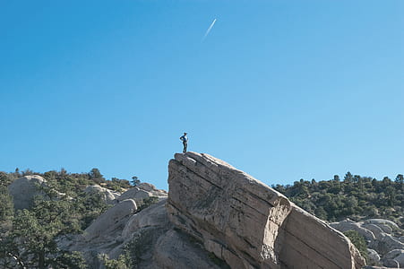 person on top of mountain thumbnail