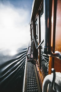 shallow focus photography of boat on water during daytime thumbnail