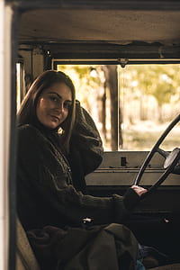 woman holding steering wheel inside car thumbnail