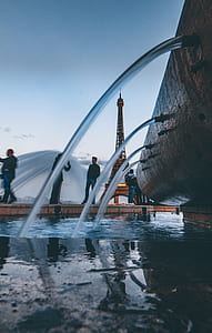 photograph of water fountain rushing onto pool thumbnail