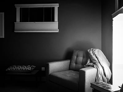 grayscale photography of armchair inside room thumbnail
