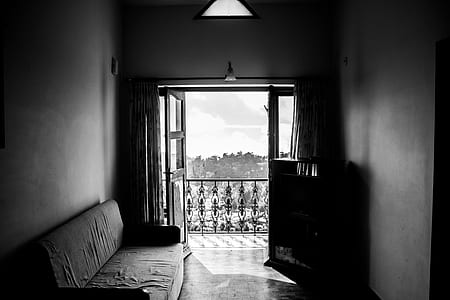 gray couch near door thumbnail