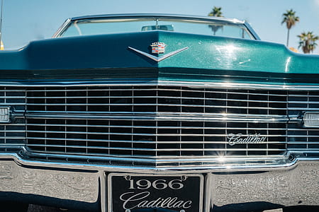 closeup photo of 1966 green Cadillac vehicle thumbnail
