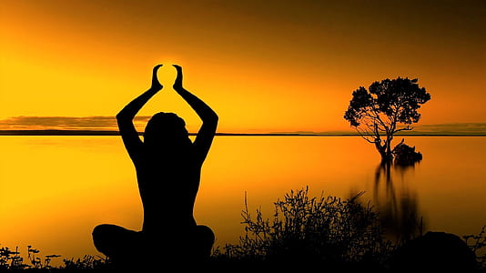 silhouette of woman meditating thumbnail