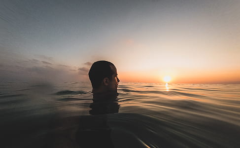 man on body of water thumbnail