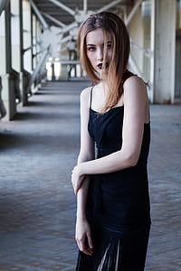 woman wearing black spaghetti strap top and skirt thumbnail