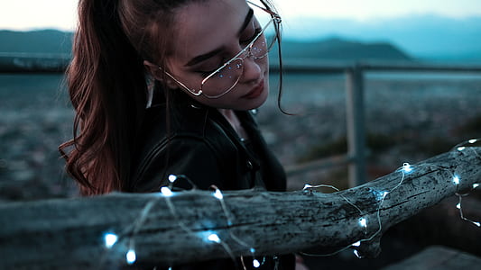selective focus photography of woman wearing sunglasses thumbnail