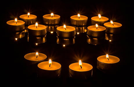low-angle of lighted tealight candles thumbnail