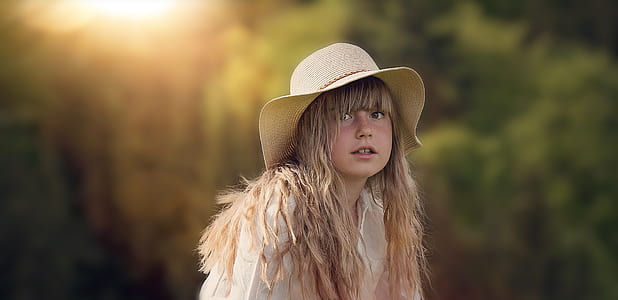 selective focus photo of woman wearing brown hat thumbnail