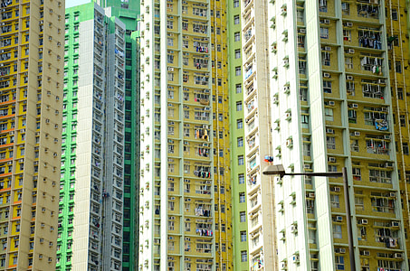 yellow, white, and green concrete buildings thumbnail