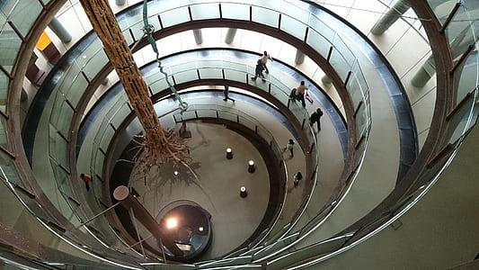 several people walking in spiral building thumbnail
