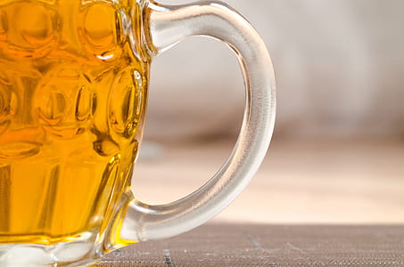 clear glass beer mug labeled with beer on brown wooden surface thumbnail