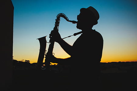 Silhouette of a Man Playing Saxophone during Sunset thumbnail
