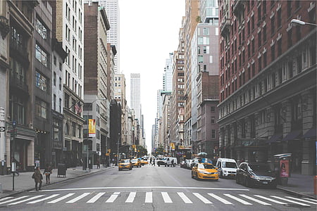 cars on road near buildings thumbnail
