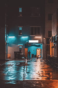 man standing near door building thumbnail