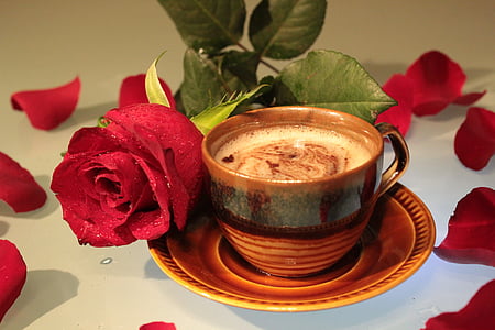 brown ceramic cup filled with coffee thumbnail