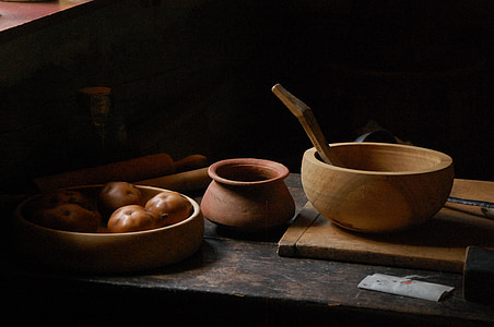 round brown bowl beside brown clay pot thumbnail