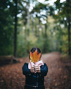 woman holding leaf thumbnail