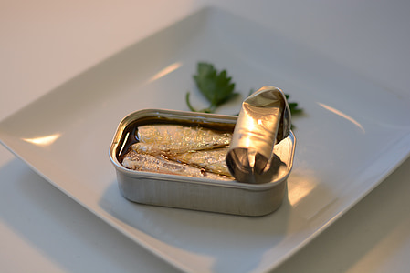 opened sardine can near parsley leaves thumbnail