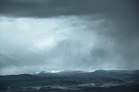 landscape photography of two parachuters thumbnail