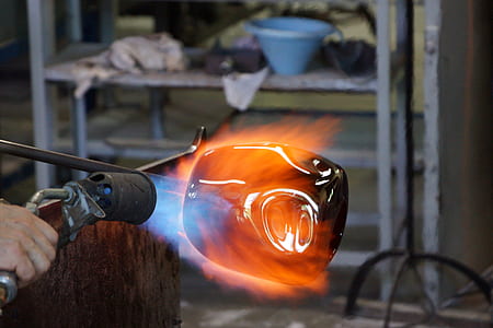 person torching black glass thumbnail