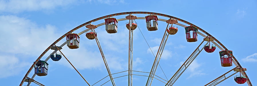brown and red ferris wheel at daytime thumbnail