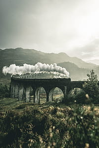 train running during daytime thumbnail