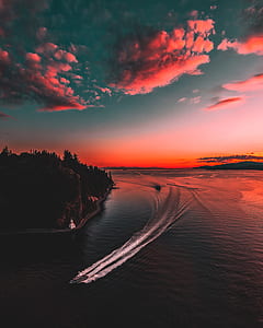 aerial photography of body of water with boat thumbnail