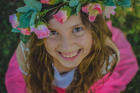 smiling girl wearing white and pink dress thumbnail
