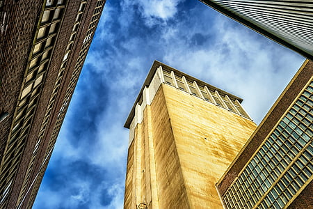 low angle photo of brown and white concrete building thumbnail