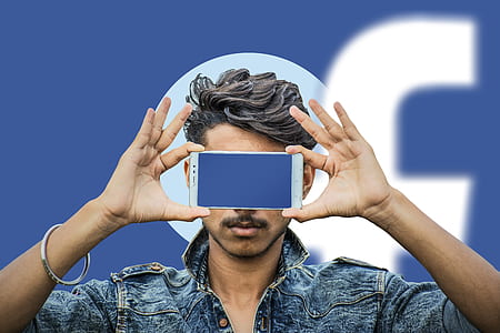 person holding white Android smartphone covering his face thumbnail