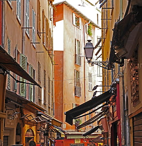 brown concrete buildings with awnings thumbnail