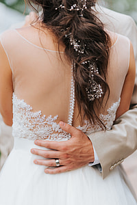 man touching woman's back thumbnail