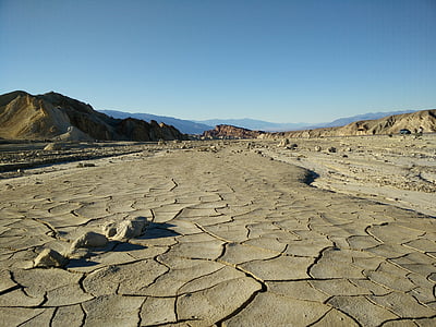 gray rocky mountains under blue sky thumbnail