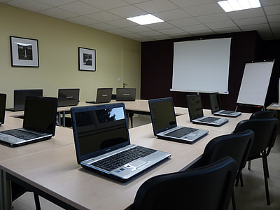 black and gray laptops on beige table thumbnail