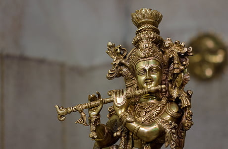 brown Krishna figure in tilt-shift lens photography thumbnail