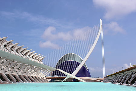 white and blue concrete building near water thumbnail
