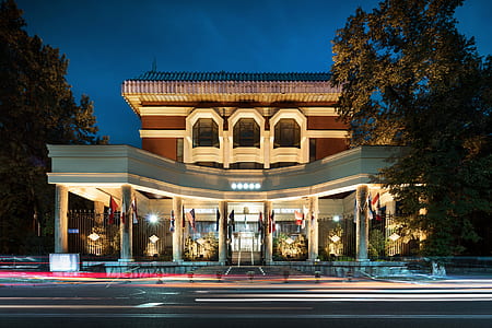 time-lapse photography of building gate near road thumbnail