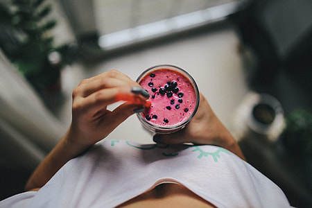 Girl holding blueberry yoghurt thumbnail