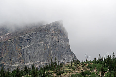 gray stone mountain cliff with fog thumbnail