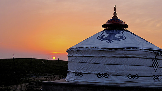 round white dome tent on desert during sunset thumbnail