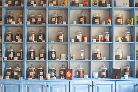 Assorted Jars on Blue Shelf Cabinets thumbnail
