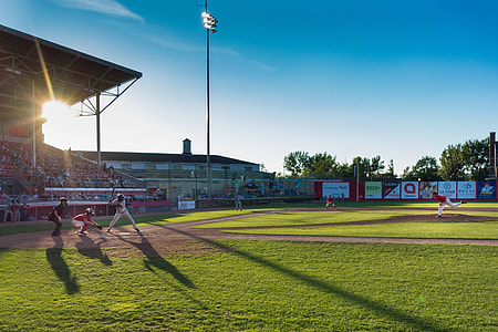 baseball players playing baseball on the field during daytime thumbnail