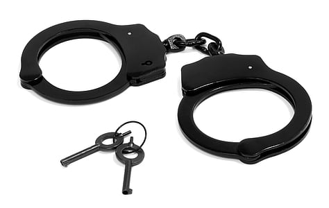 silver keys and black handcuffs thumbnail