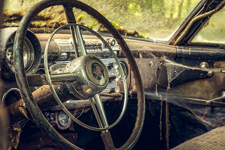 macro photography of black steering wheel thumbnail