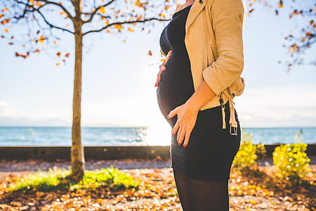pregnant woman holding her tummy thumbnail