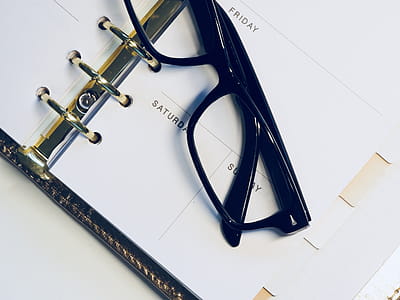 Black Framed Wayfarer Style Eyeglasses on White Surface thumbnail