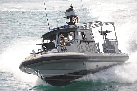 patrol boat cruising on body of water thumbnail
