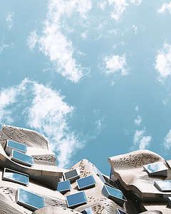 worm's eye view photography of cloudy blue sky during daytime thumbnail