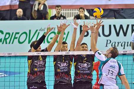 four man playing volleyball thumbnail